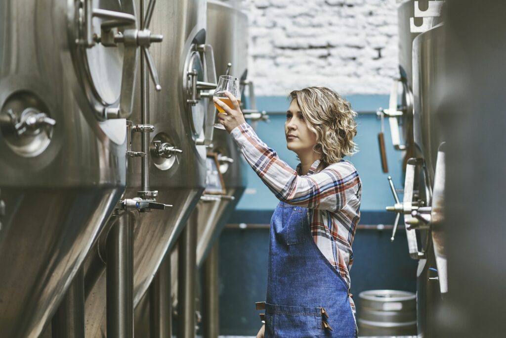 Buenos Aires Female Craft Brewer Checking Sample For Clarity
